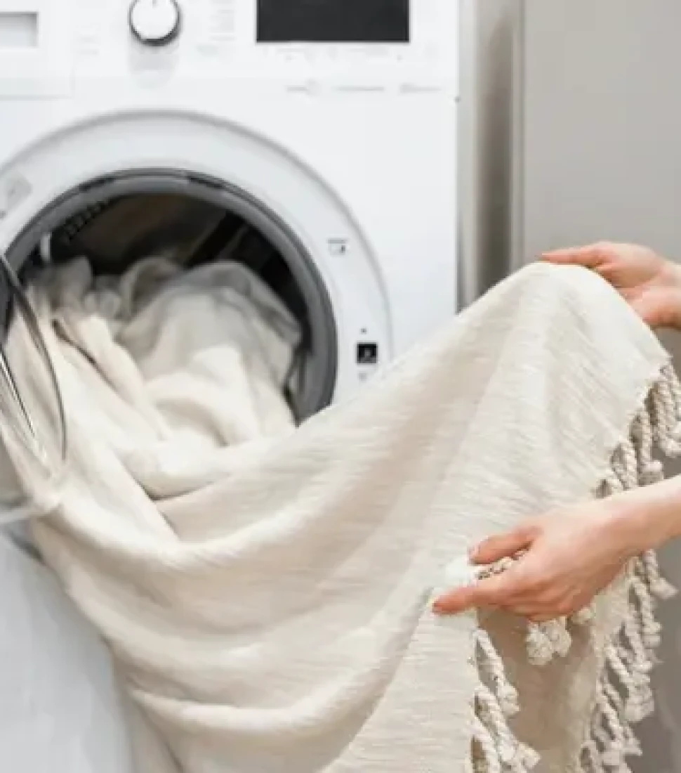 cropped-view-woman-unloading-laundry-600nw-2178807931